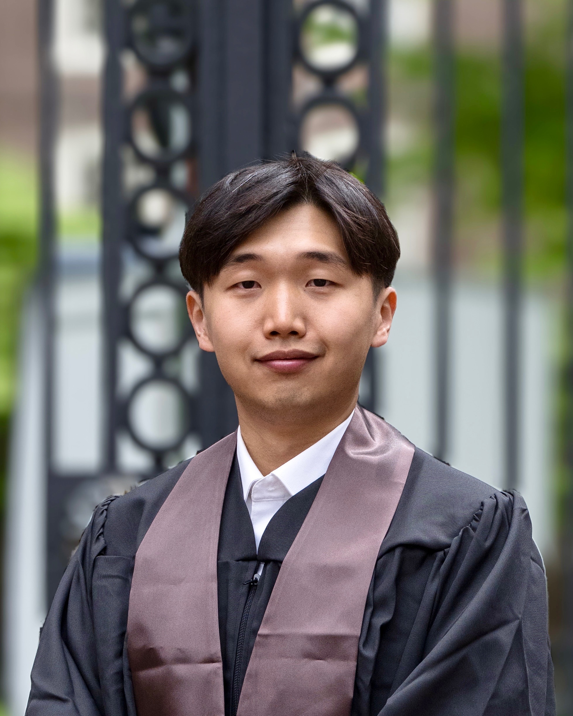 A photo of Seong-Heon Jung in graduation garments