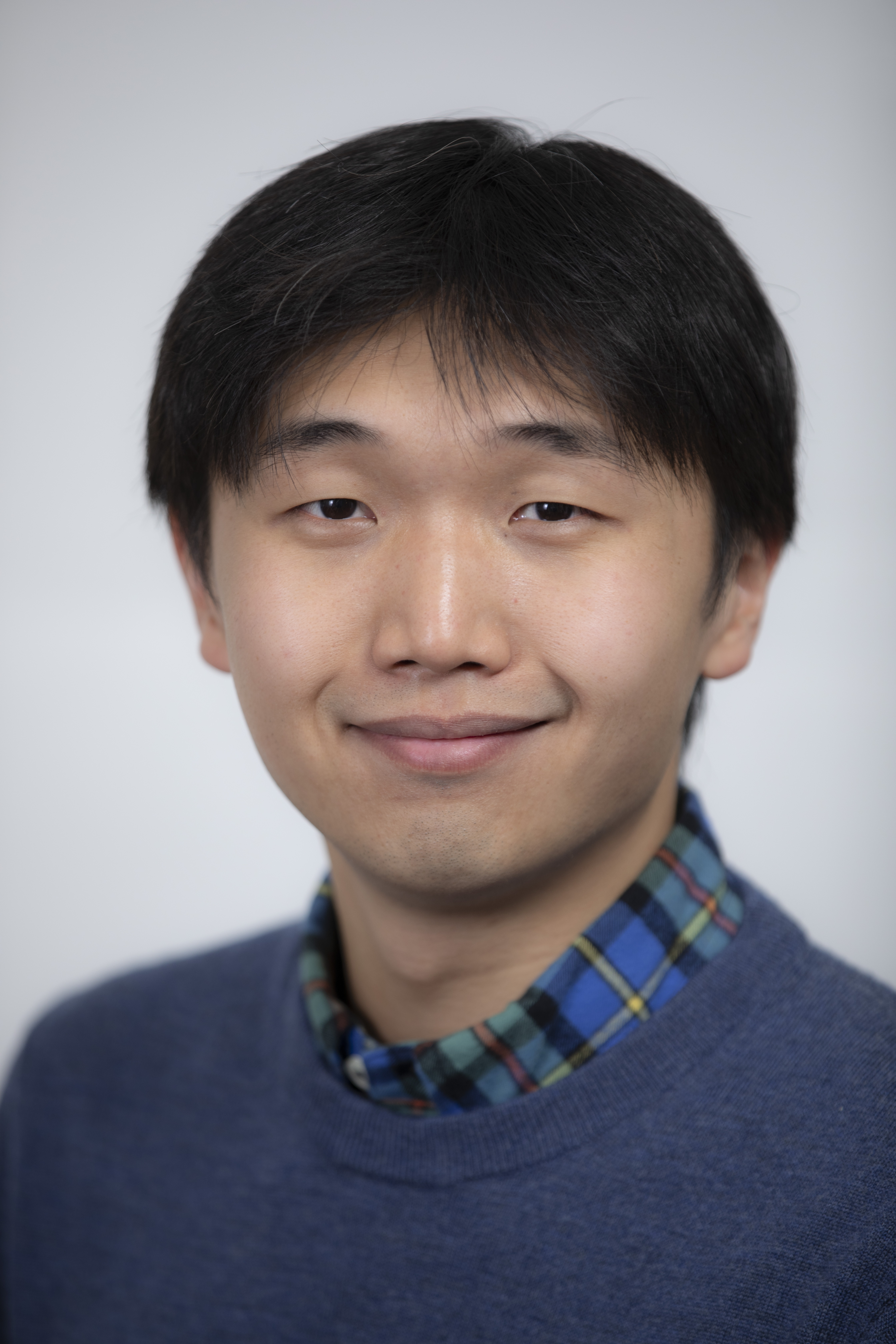 A photo of Seong-Heon Jung in a blue sweater